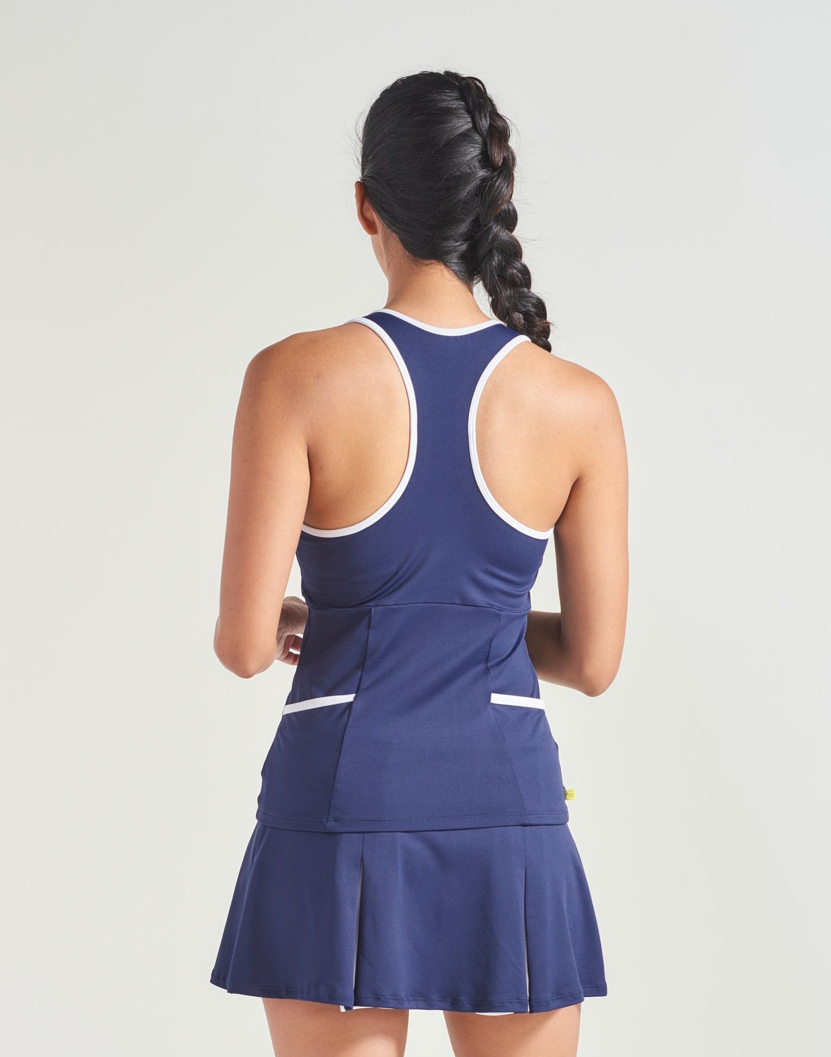 Navy women's tennis clothing tank top with white trim.