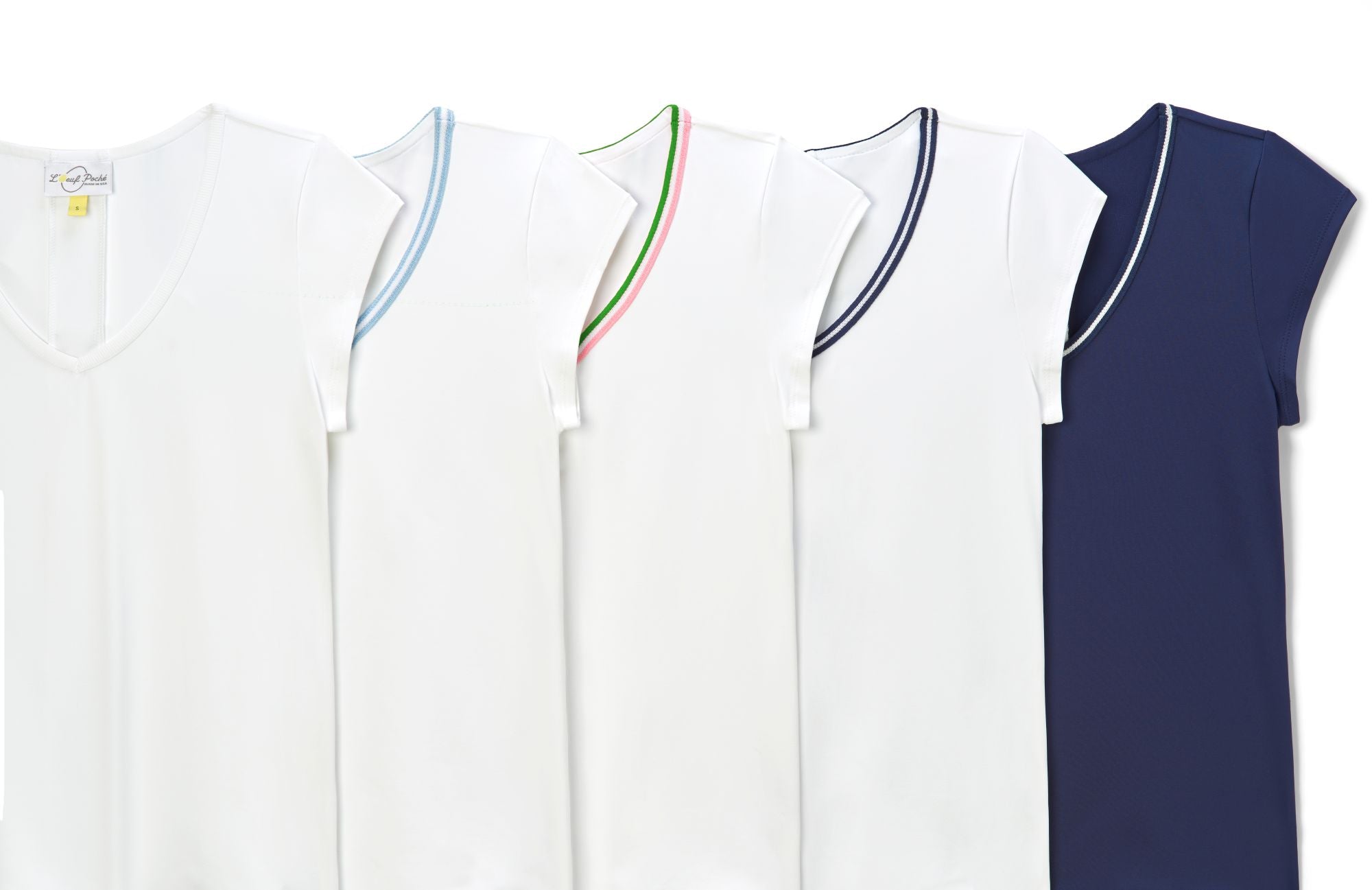Variety of sportswear white and navy tennis shirts with colored trims.