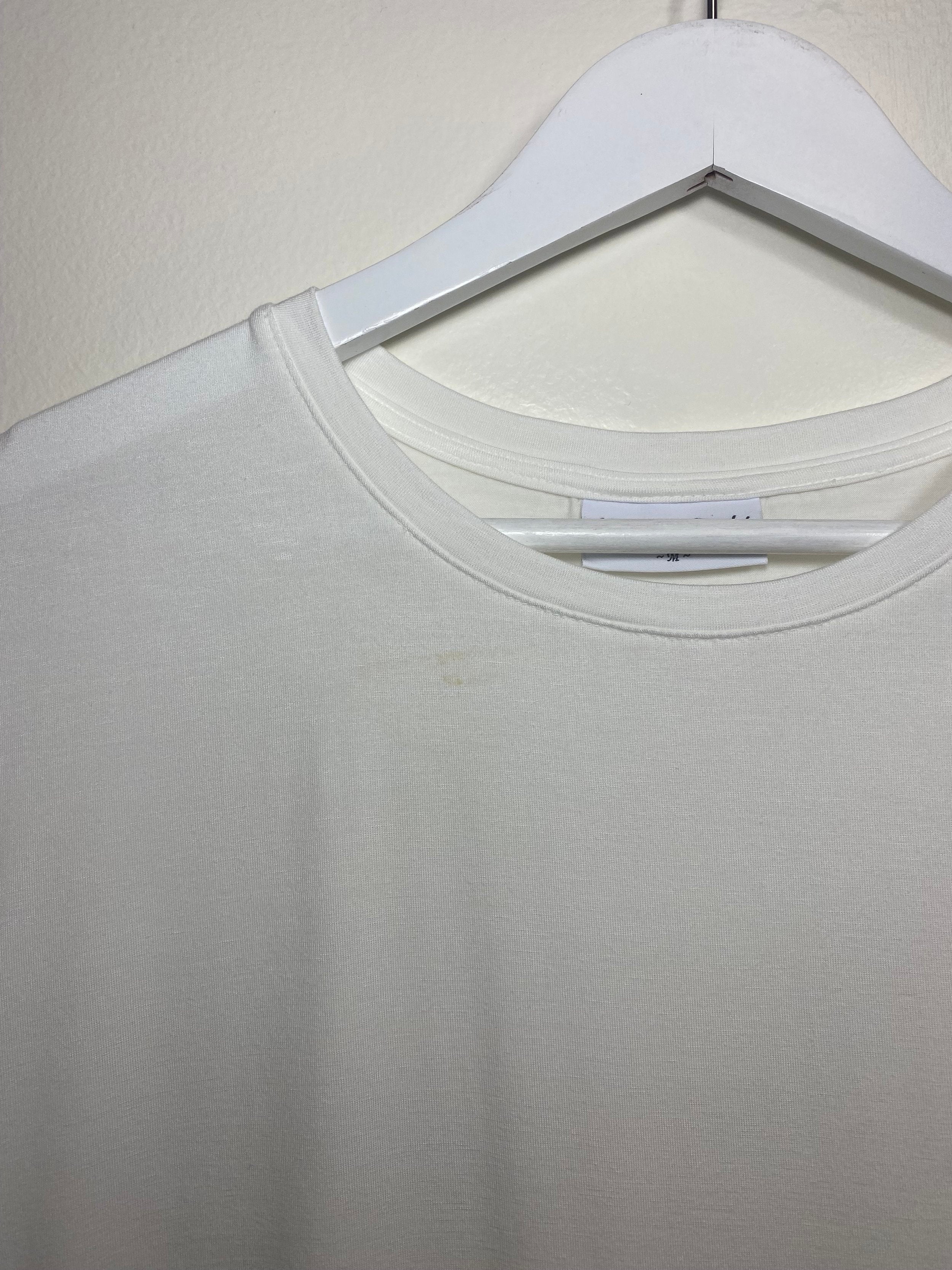 Detail view of all white tennis shirt for women