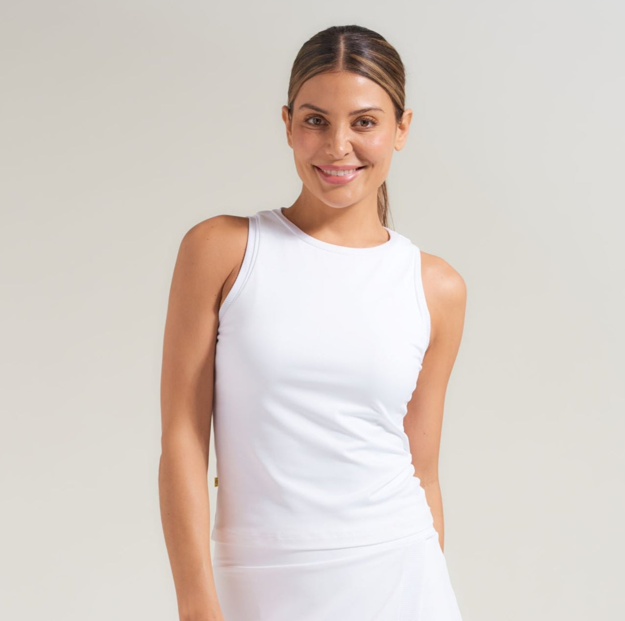 Tennis shirt for women in all white with white piping accent.