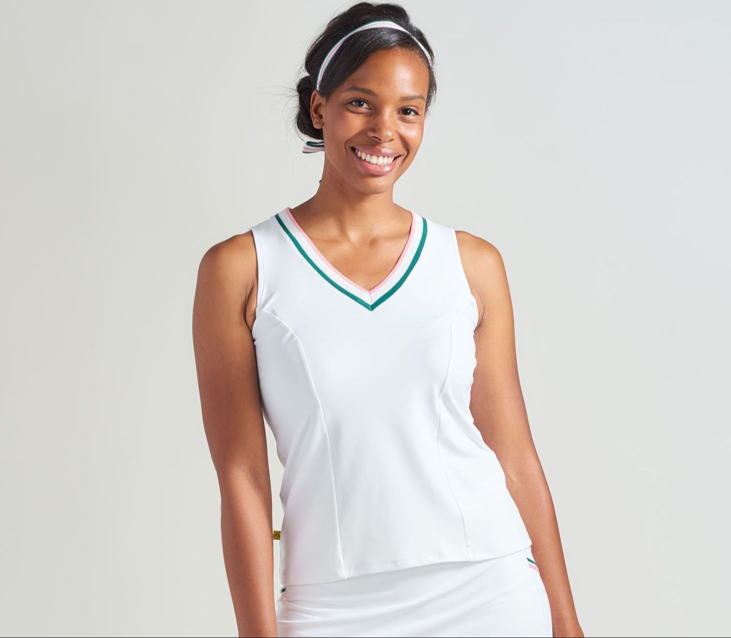 Women's tennis tank top with pink and green accent rib trim.