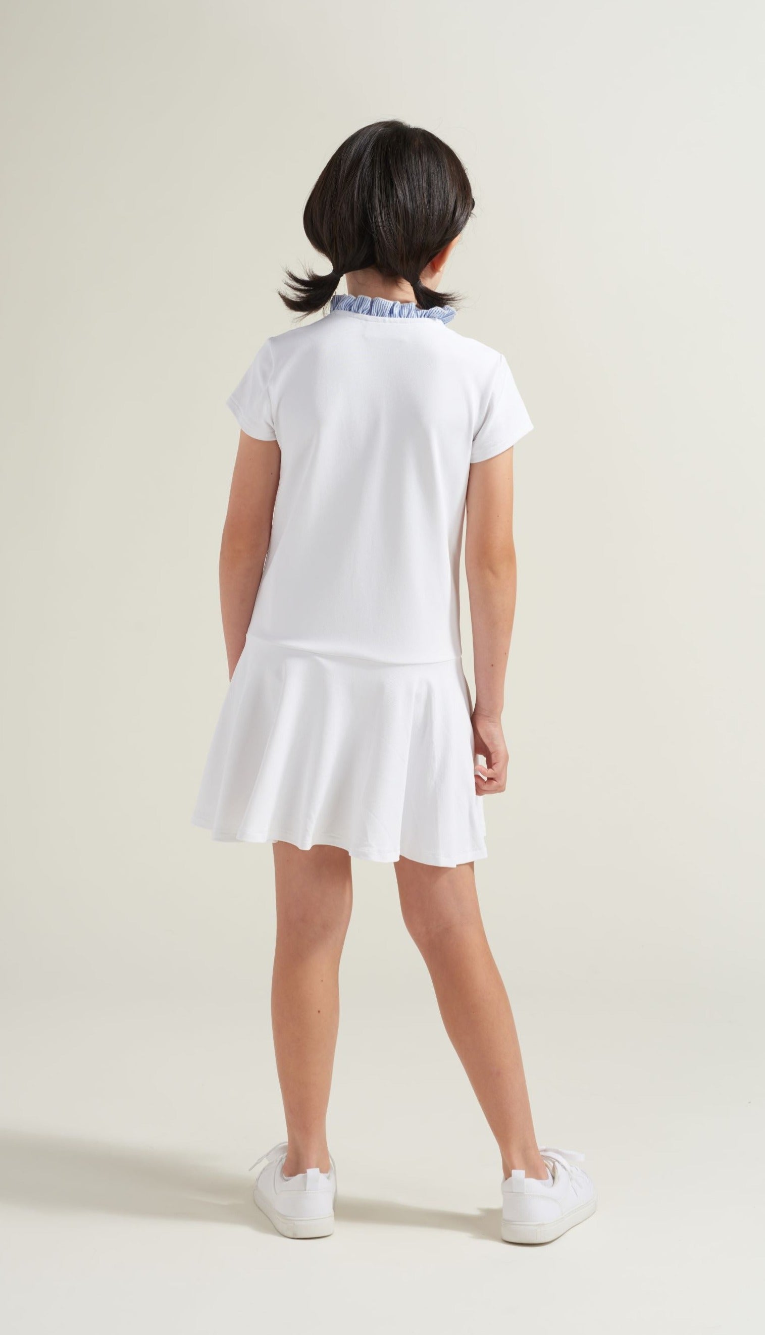 Back view of youth girls white tennis dress