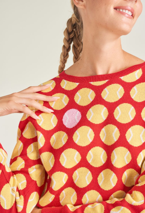 Detail shot of woman tennis athlete wearing knitted tennis sweater for women.