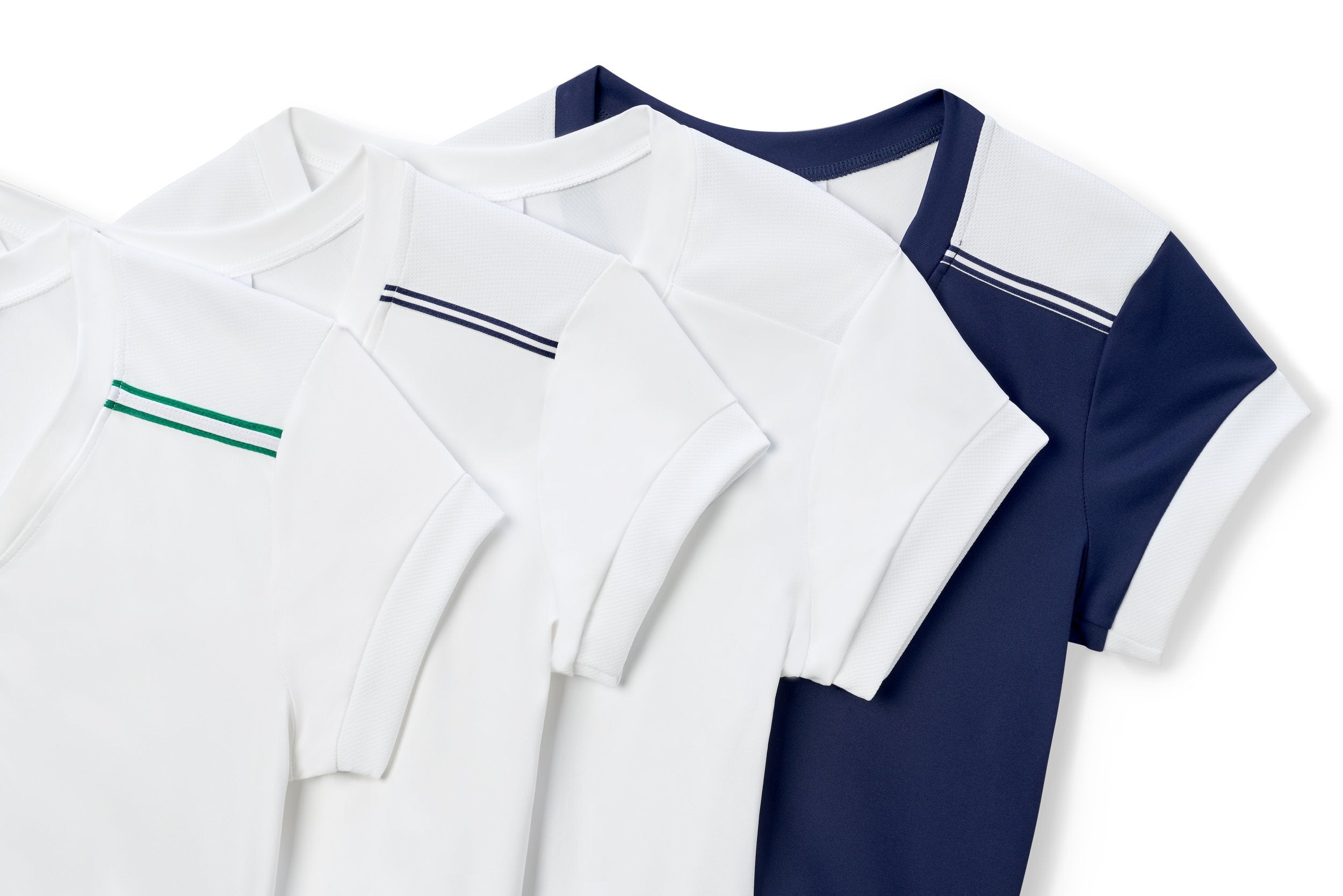 Variety of tennis tops with colored trims and button down necklines.
