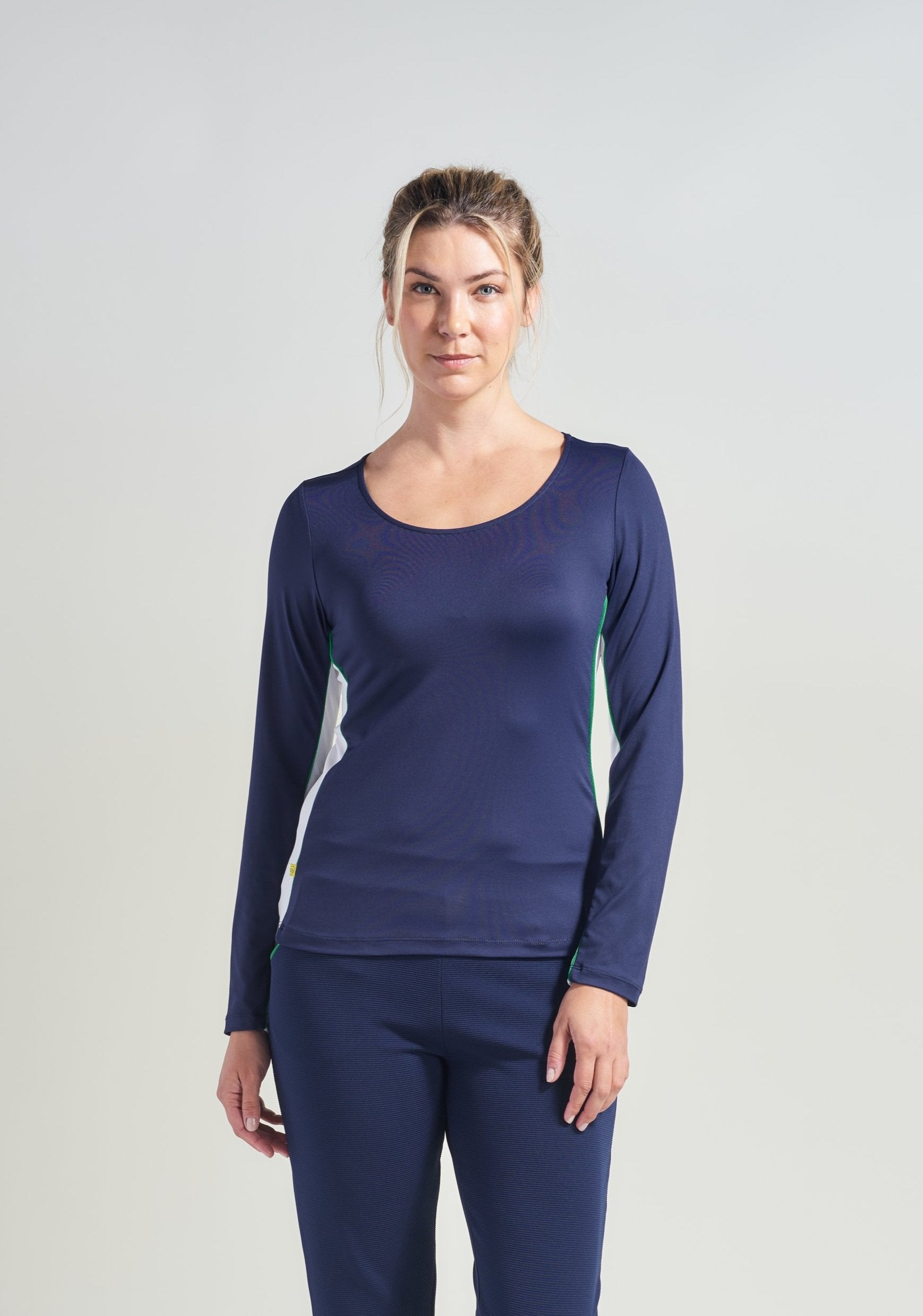 Tennis long sleeve shirt for women in navy white white mesh for breathability.