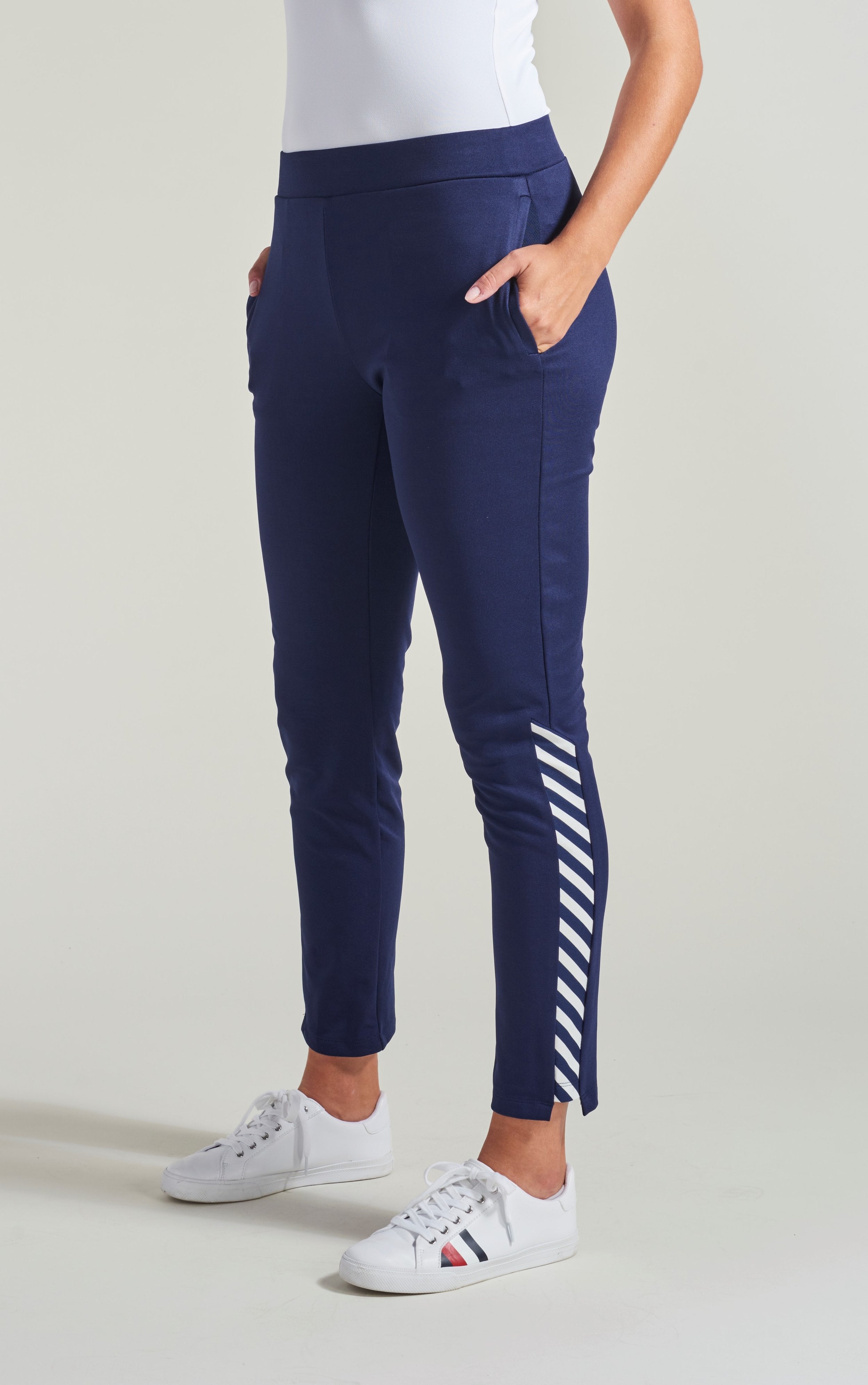 Navy warm up pants for women with navy and white accent trim and side pockets.