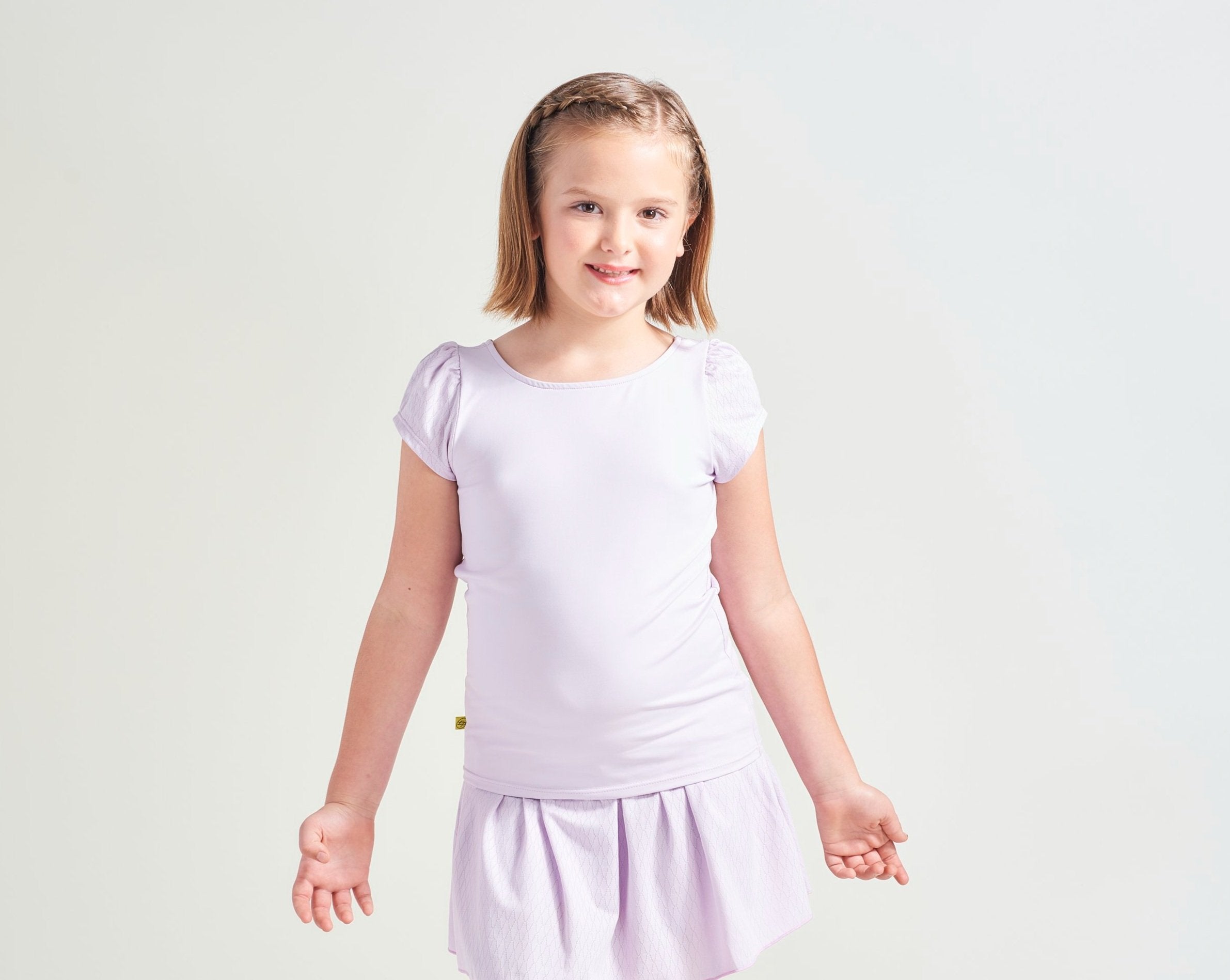 Kids tennis shirt in lavender with matching tennis skort.