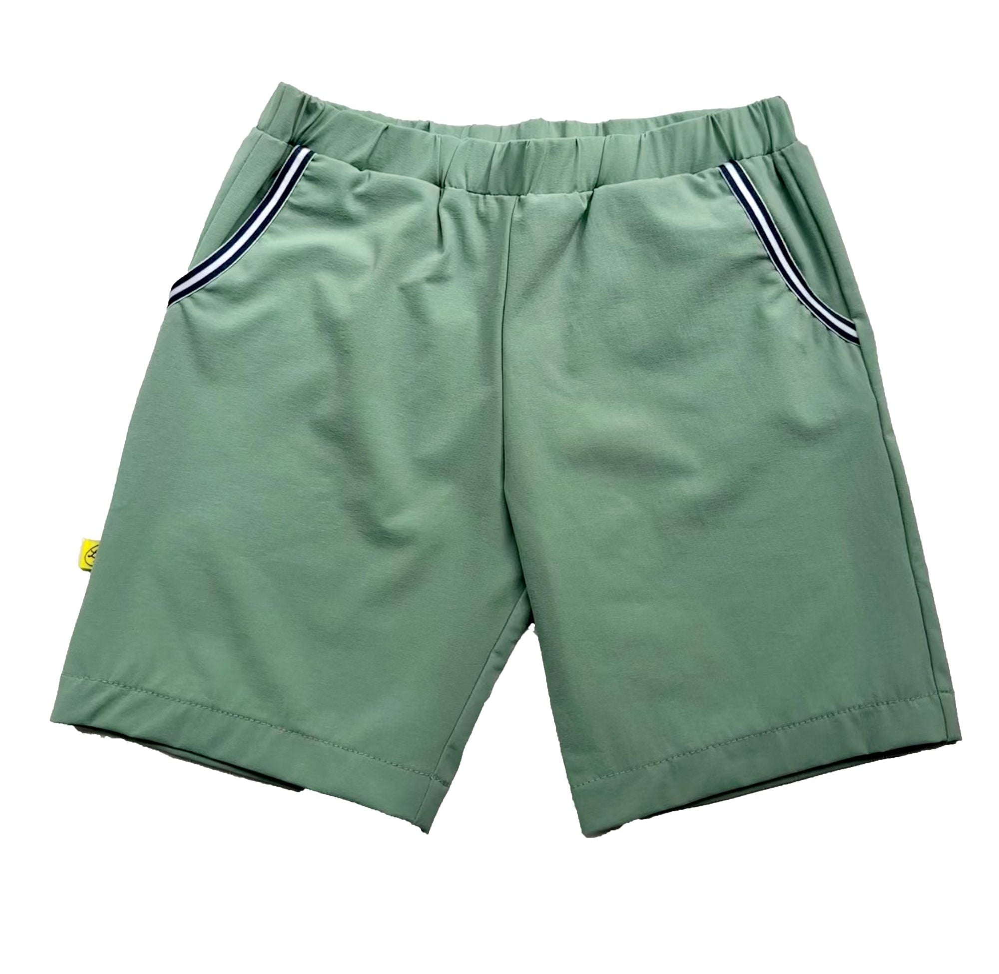 Green boy's shorts for tennis with navy and white trim. 
